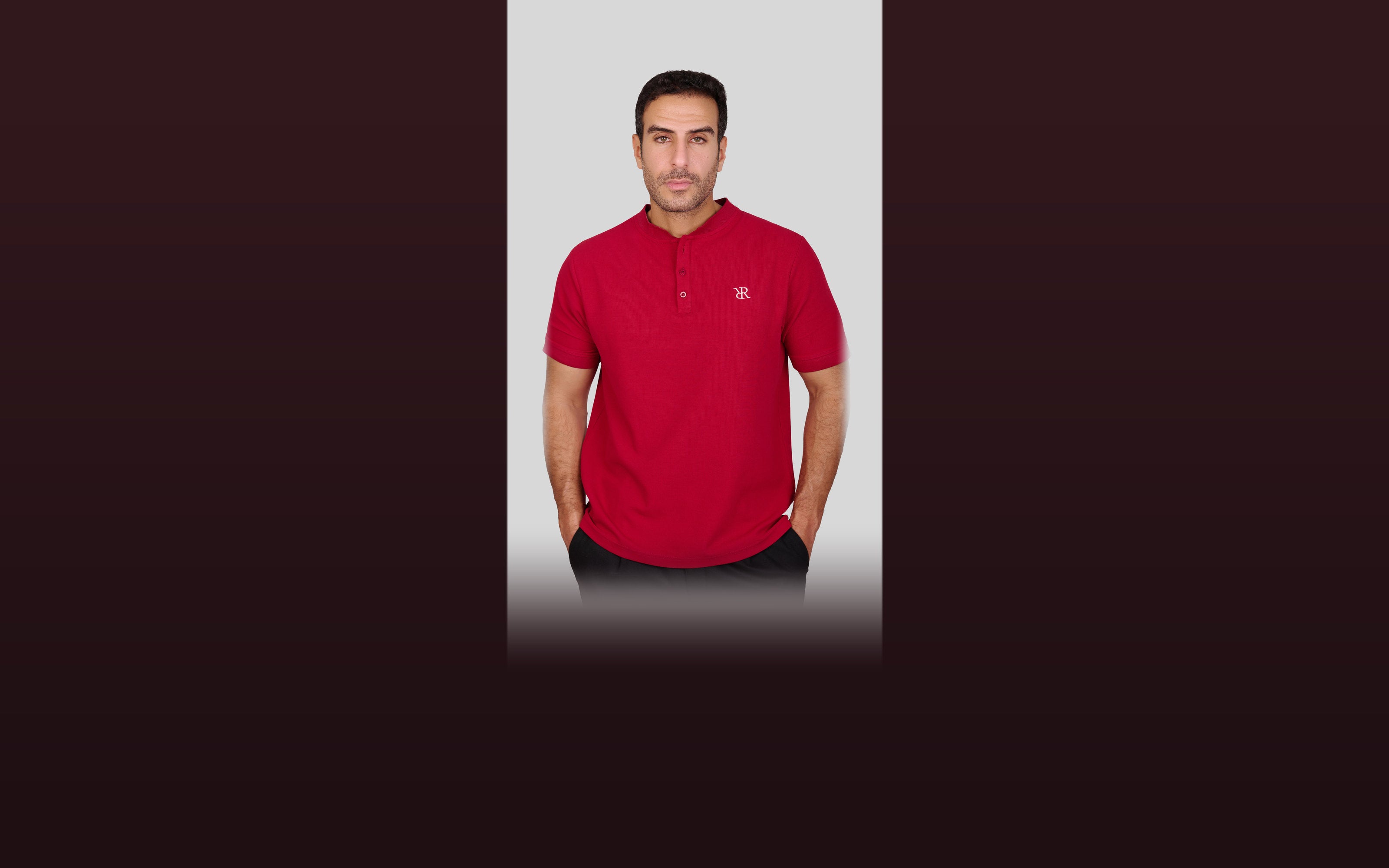 Rflx waffle-knit mandarin collar henley tee in crimson, full-length front view worn with black trousers, showing the mandarin collar, two-button placket, chest monogram and curved hem