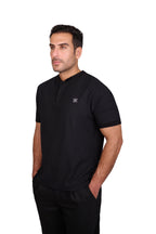 Rflx Reflection Polo, a cotton knit polo with a ribbed mandarin band collar, in black, front view worn with black trousers