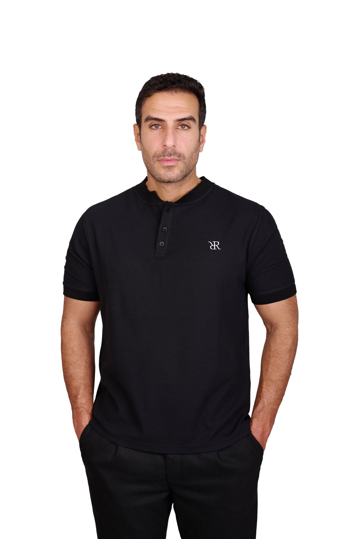 Rflx Reflection Polo, a cotton knit polo with a ribbed mandarin band collar, in black, three-quarter view showing the shoulder and ribbed cuff