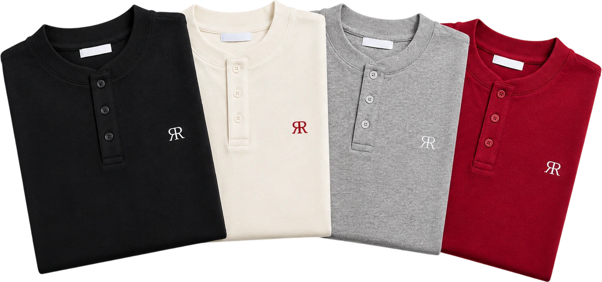 Four Reflection Polos folded side by side, one in each colourway: black, cream, heather grey and crimson