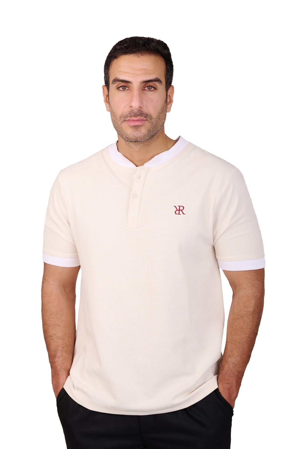 Rflx Reflection Polo, a cotton knit polo with a ribbed mandarin band collar, in cream with white ribbed trim, front view worn with black trousers