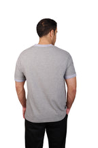 Rflx Reflection Polo, a cotton knit polo with a ribbed mandarin band collar, in heather grey with lilac ribbed trim, back view showing the plain body and ribbed band collar