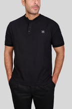 Rflx waffle-knit mandarin collar henley tee in black, close view of the waffle texture, two-button placket and chest monogram