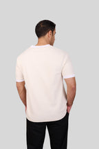 Rflx waffle-knit mandarin collar henley tee in cream with white ribbed trim, back view showing the plain body and ribbed collar