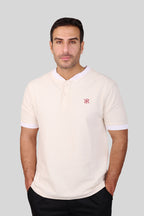 Rflx birdseye knit mandarin collar henley tee in cream with white ribbed trim, front view worn with black trousers