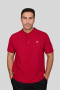Rflx birdseye knit mandarin collar henley tee in crimson, front view worn with black trousers