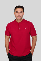 Rflx birdseye knit mandarin collar henley tee in crimson, front view worn with black trousers
