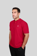 Rflx waffle-knit mandarin collar henley tee in crimson, three-quarter view showing the shoulder and sleeve