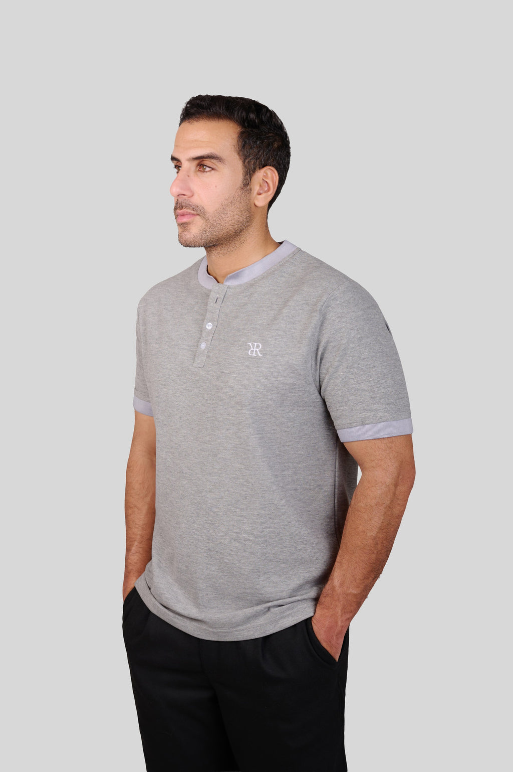 Rflx waffle-knit mandarin collar henley tee in heather grey with lilac ribbed trim, three-quarter view showing the shoulder and sleeve