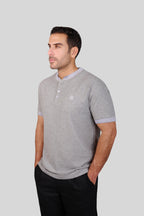 Rflx waffle-knit mandarin collar henley tee in heather grey with lilac ribbed trim, three-quarter view showing the shoulder and sleeve